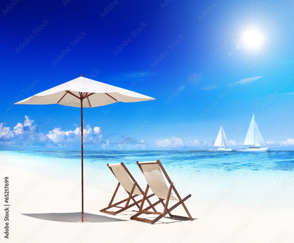 Deck Chairs on Beach with View of Sail Boats