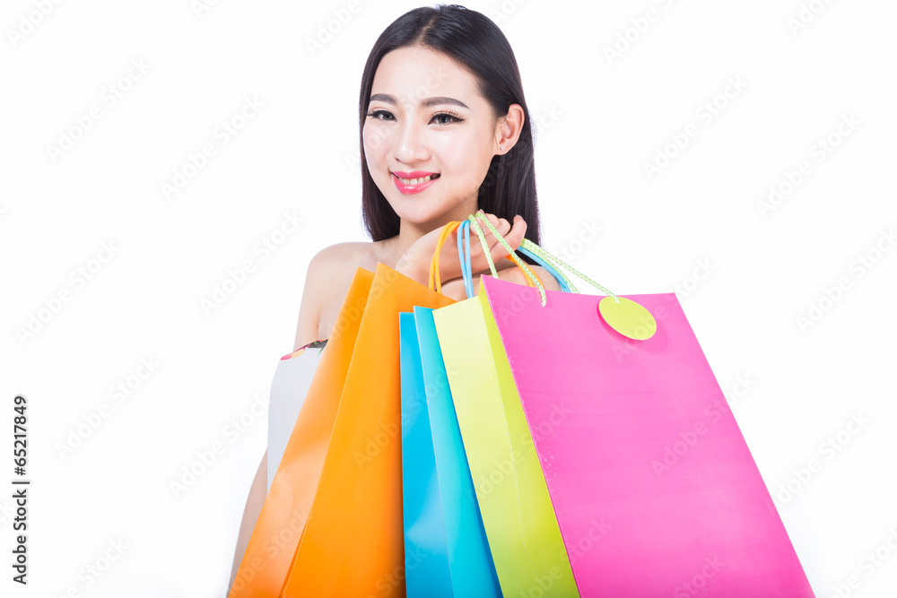 young woman with shopping bags over white background young woman with shopping bags over white background
