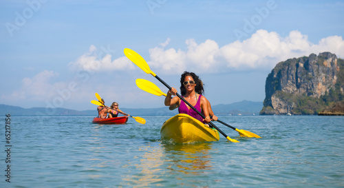 Young couple sea kayaking photo