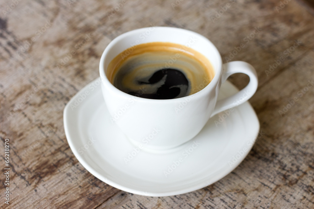 Cup of coffee on a wooden table Cup of coffee on a wooden table