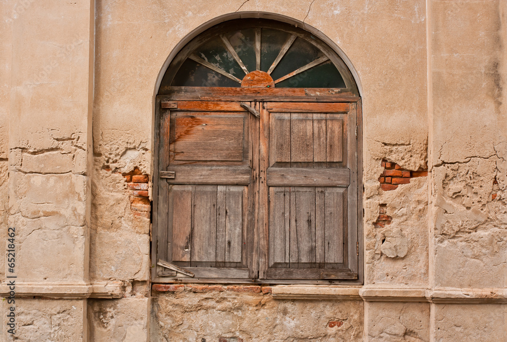 Ancient wooden window with concrete wall old