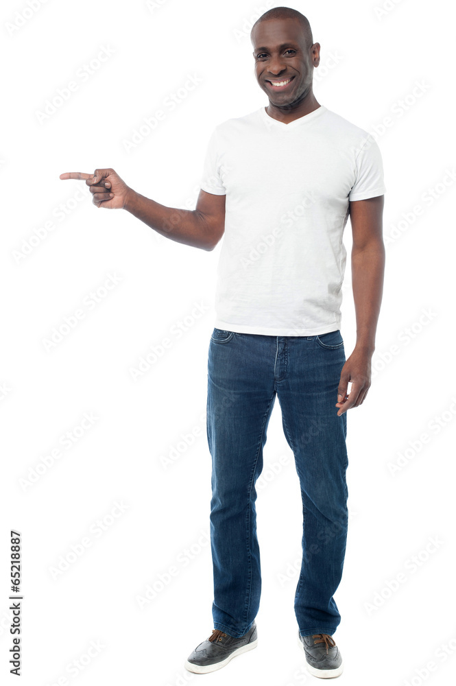 Smiling aged man pointing away Smiling aged man pointing away