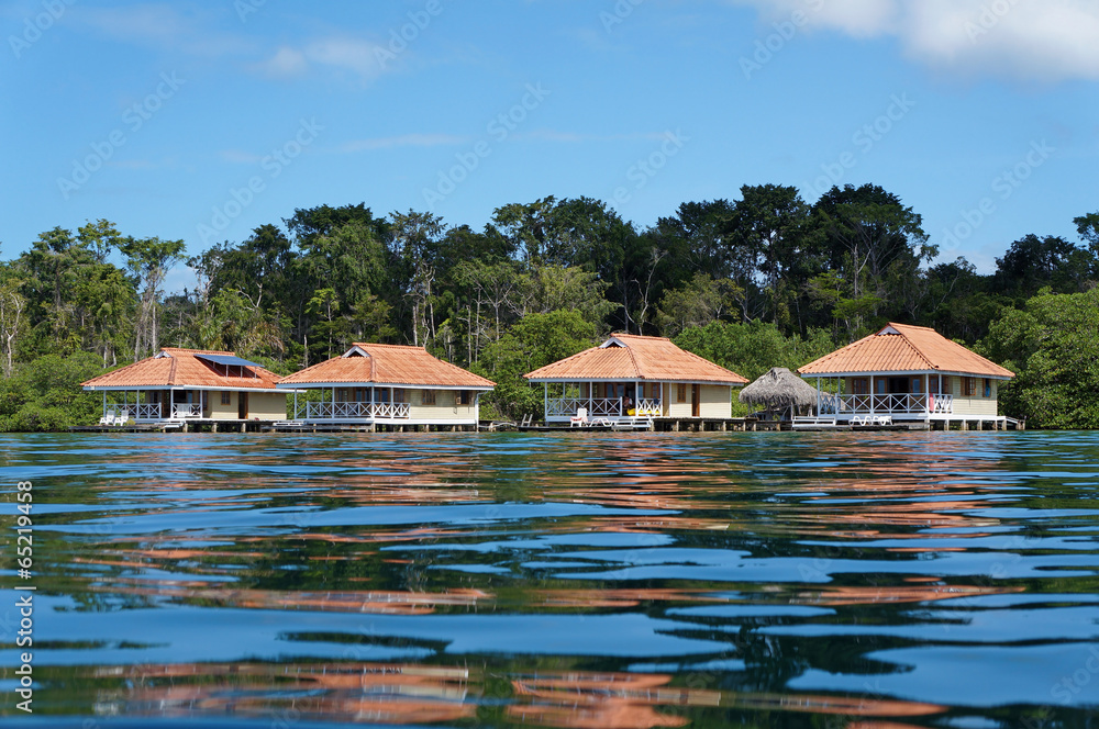 Vacation houses over the sea with water surface Vacation houses over the sea with water surface