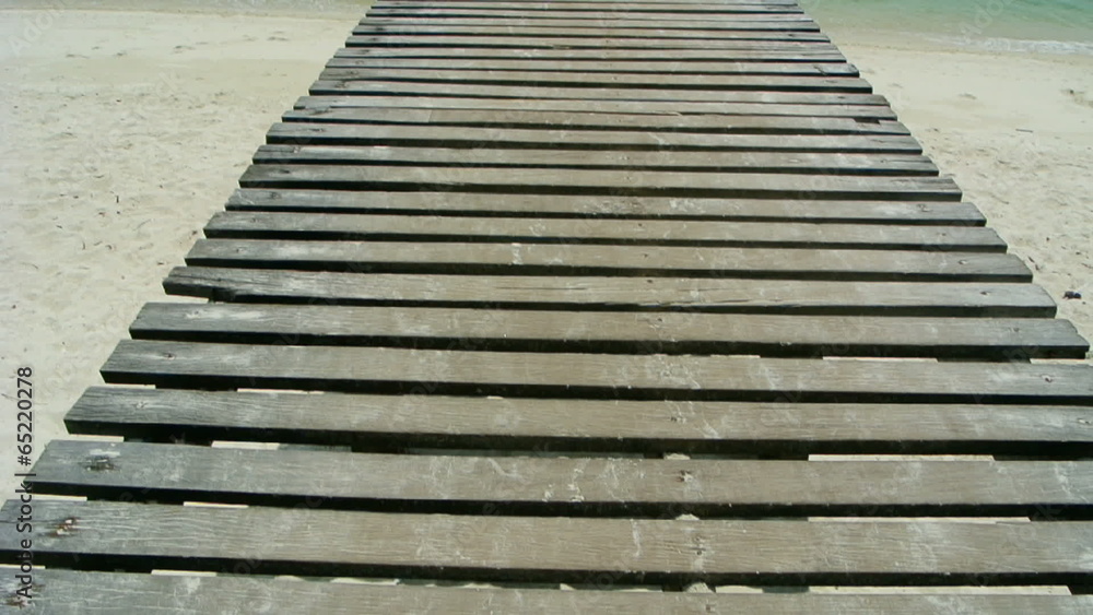 Panning view walkway to pier on island , full HD. Panning view walkway to pier on island , full HD.