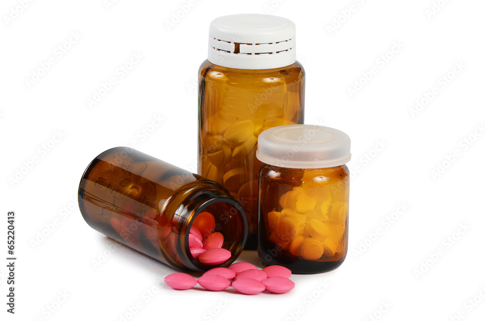Tablets to a glass jar isolated on white Tablets to a glass jar isolated on white