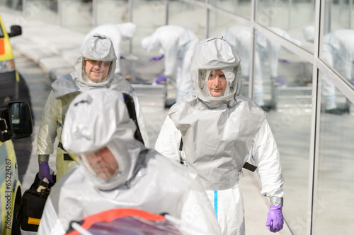Biohazard medical team in protective uniform