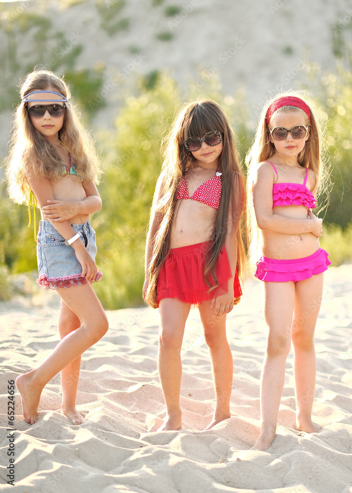 Portrait of children on the beach in summer Portrait of children on the beach in summer