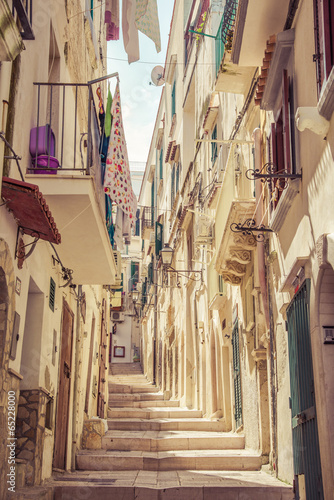 Italian narrow white old street in Apulia, Vieste, South Italy.