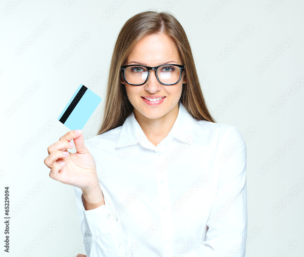 portrait of a smiling business woman holding blank credit card.