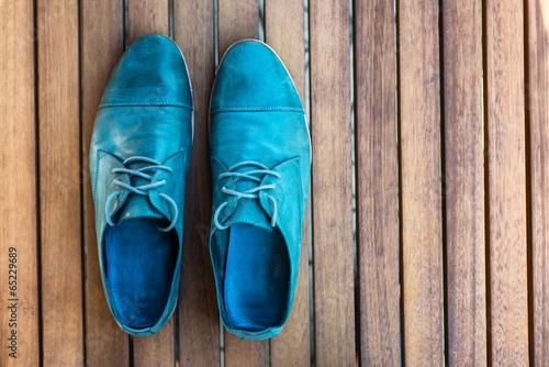 Man shoes on wooden background