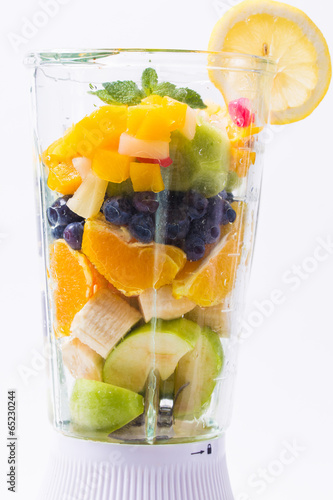 Mixed exotic fruits with leaf of mint in the blender