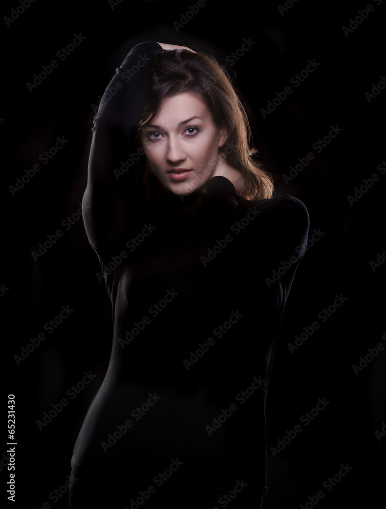 beautiful young woman on a black background beautiful young woman on a black background