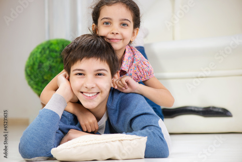 Happy brother and cute little sister