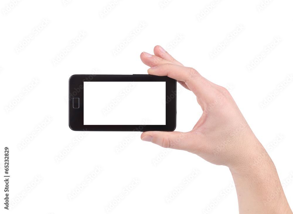 Hand holds cell phone with clipping path.