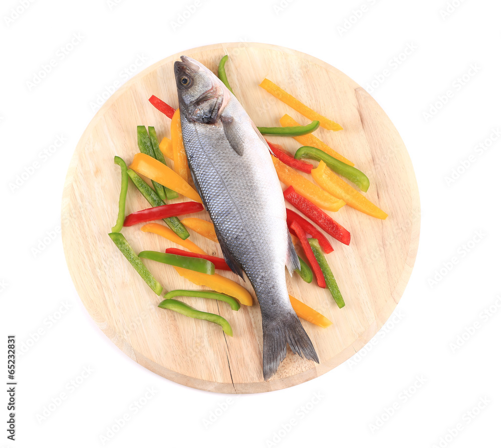 Fresh seabass fish on colorful pepper. Fresh seabass fish on colorful pepper.