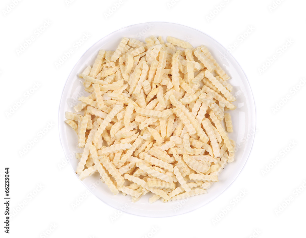 Abundant frozen french fries in plate. Abundant frozen french fries in plate.