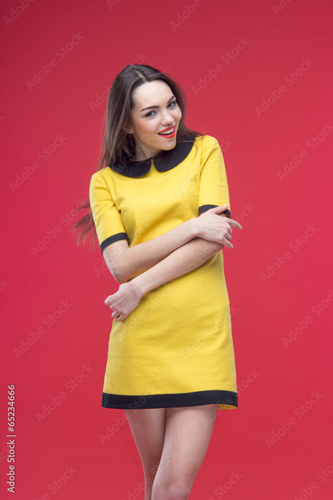 Woman half length on red background