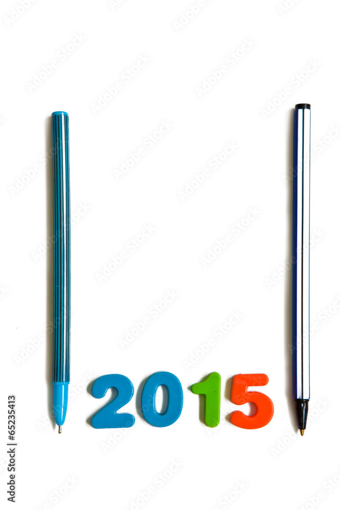 число 2015 и ручки на белом фоне число 2015 и ручки на белом фоне
