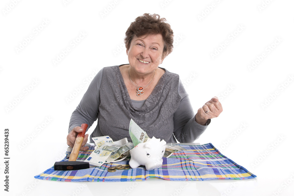 Oma freut sich über Bargeld von der Spardose StockFoto Adobe