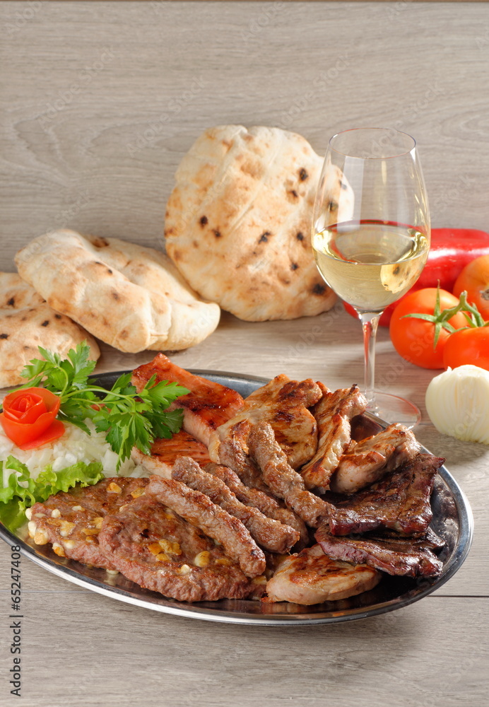 Mixed grill on a plate with excellent wine Mixed grill on a plate with excellent wine