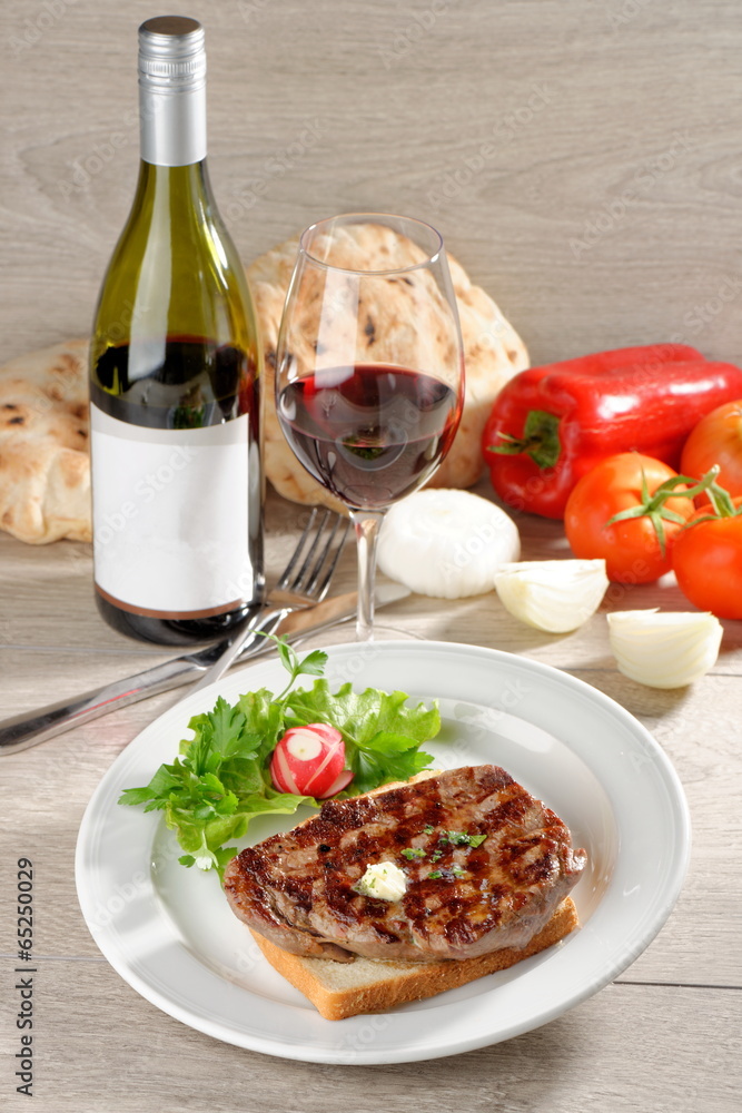 Grilled steak on toast bread, served with onion and vegetable Grilled steak on toast bread, served with onion and vegetable