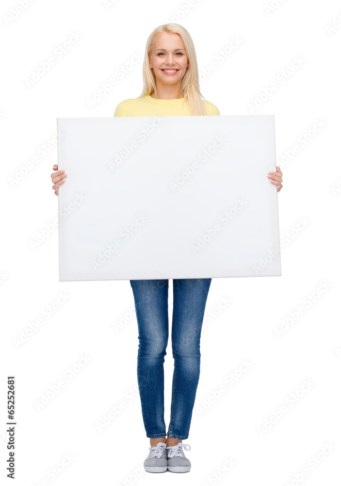smiling woman in sweater with blank white board smiling woman in sweater with blank white board