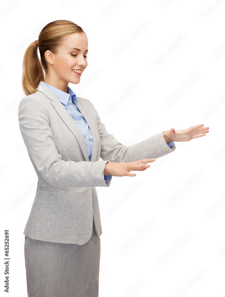 smiling businesswoman pointing to something smiling businesswoman pointing to something