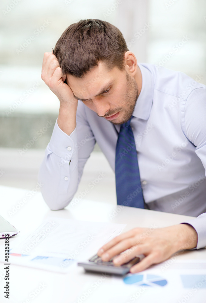 stressed businessman with laptop and documents stressed businessman with laptop and documents
