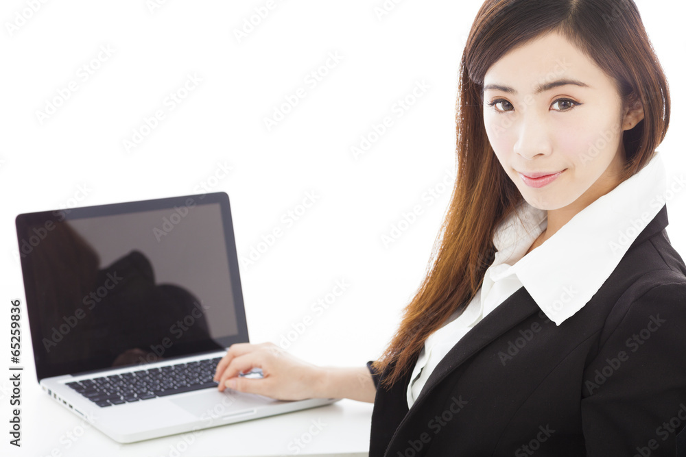 young businesswoman sitting and using a laptop young businesswoman sitting and using a laptop
