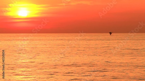 Beautiful mystic sunrise and offshore platform in the middle of the ocean
 photo