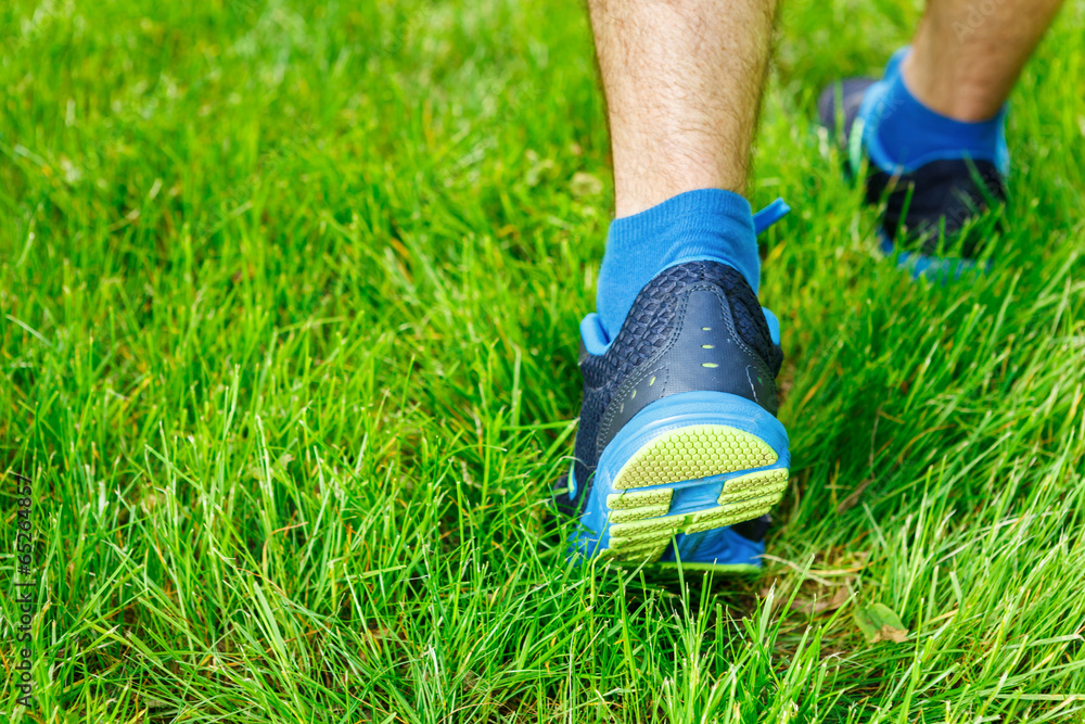 Closeup of a male runner standing - Fitness concept. Closeup of a male runner standing - Fitness concept.