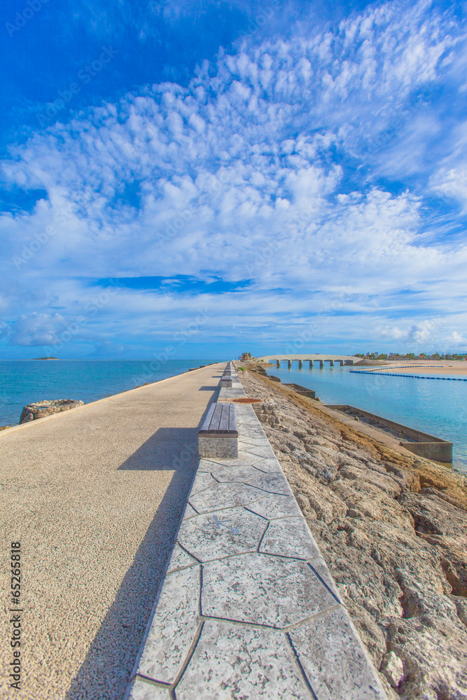 Road of breakwater and blue sky