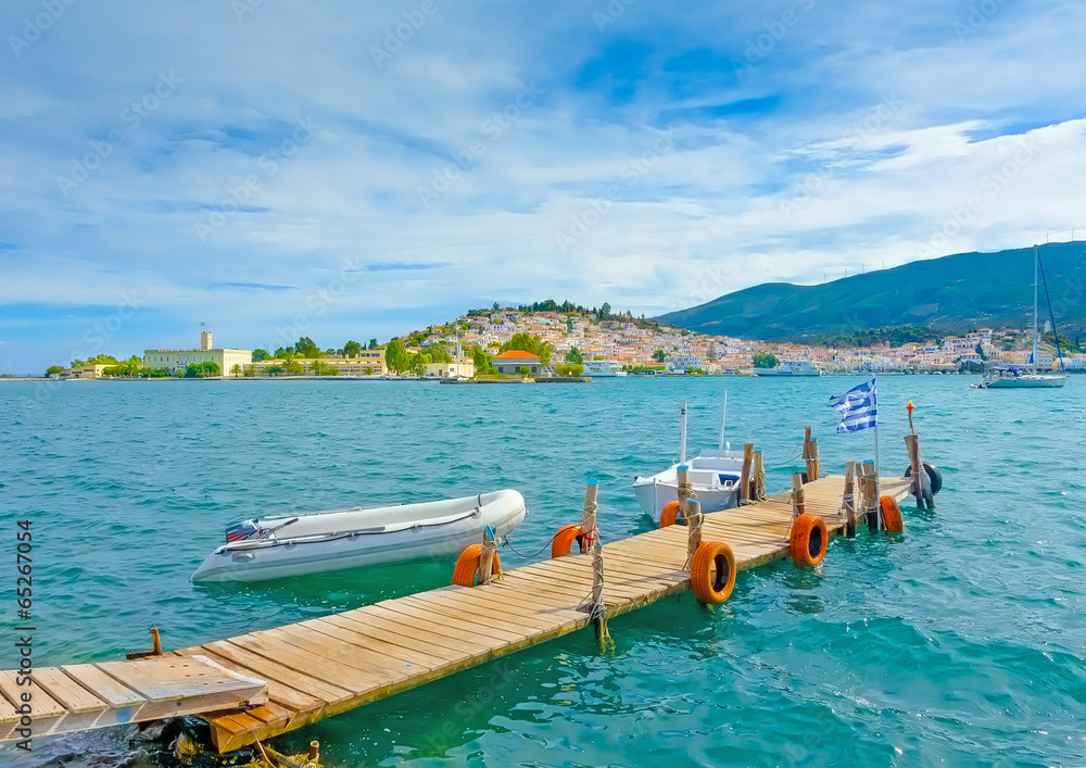 wooden pier with fishing boats at Poros island in Greece