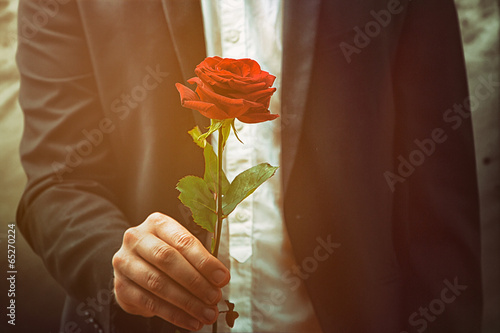 Man offers a rose