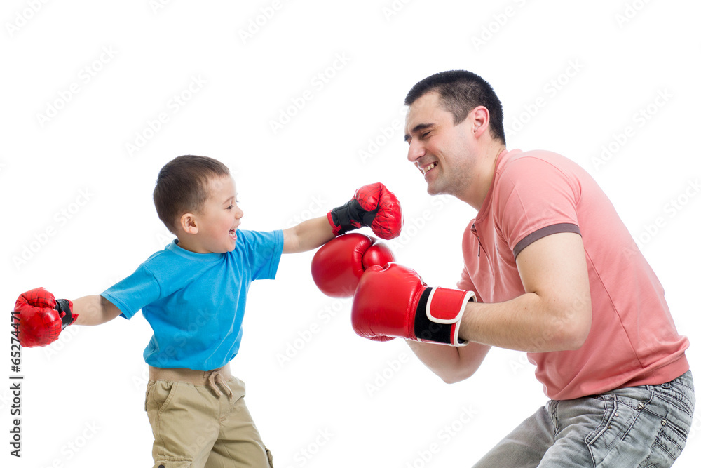 kid and father play with boxing gloves