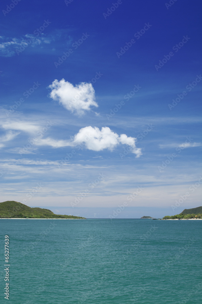 White cloud over blue sky, sea and islands White cloud over blue sky, sea and islands