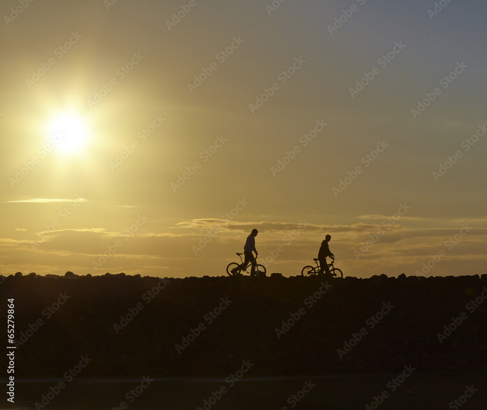 Silhouettes of the boys and their bikes