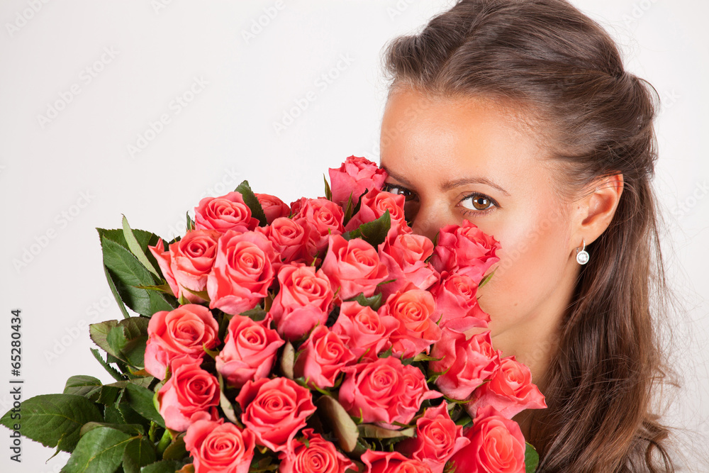 Beautiful woman with a bouquet of roses Beautiful woman with a bouquet of roses