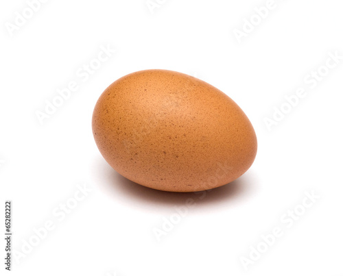 single brown egg isolated on white background