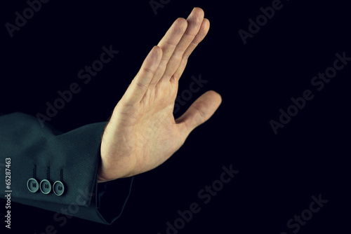 Schilderij op canvas Man raising his hand in a stop gesture