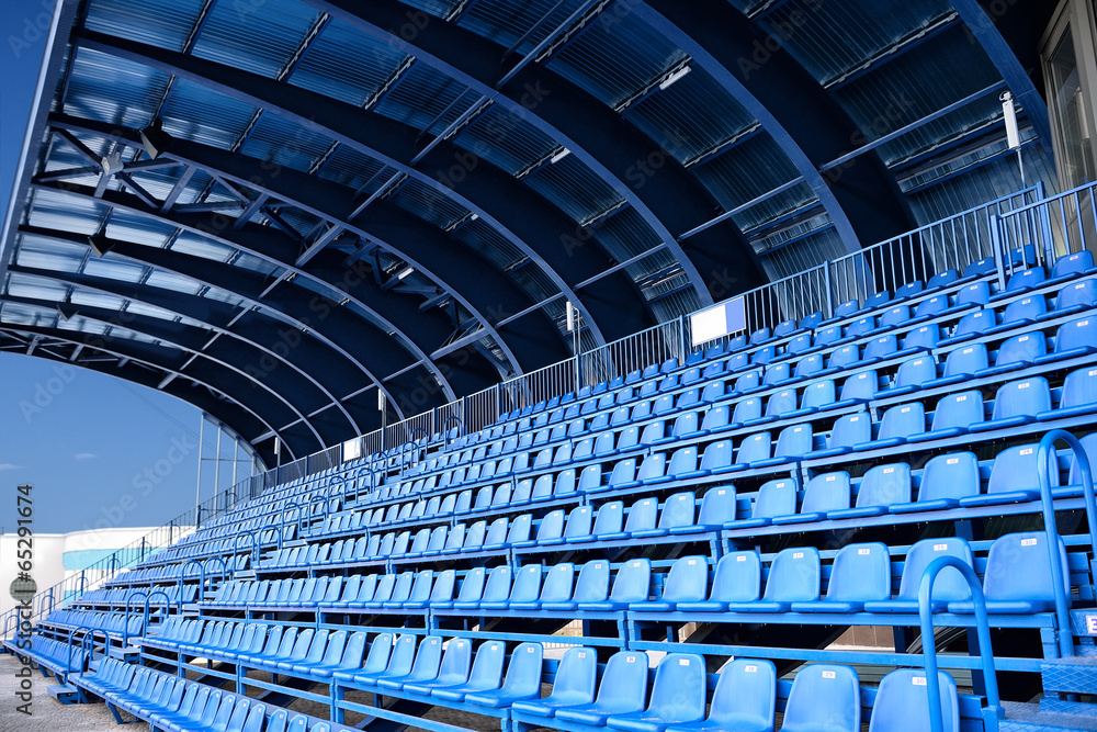 Naklejka premium empty blue seat at Stadium