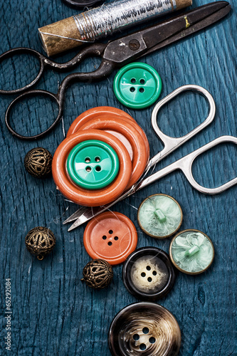 buttons and sewing tool