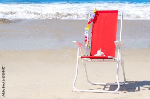 Fototapeta Naklejka Na Ścianę i Meble -  Beach chair by the ocean