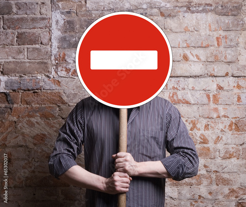 Quadro em tela A man holds a sign forbidding face.
