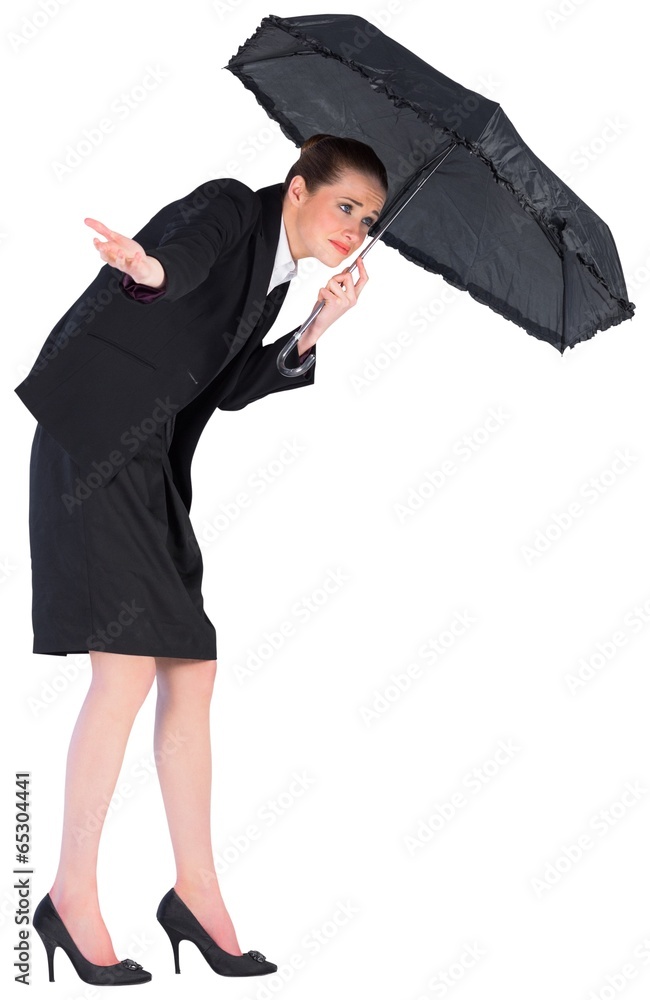 Businesswoman holding a black umbrella Businesswoman holding a black umbrella