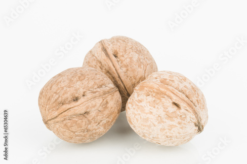 Brown greek nut on white background.