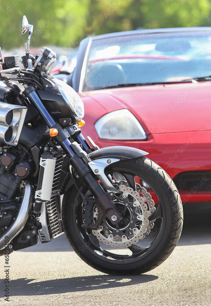 Fototapeta premium motorcycle and car on the road