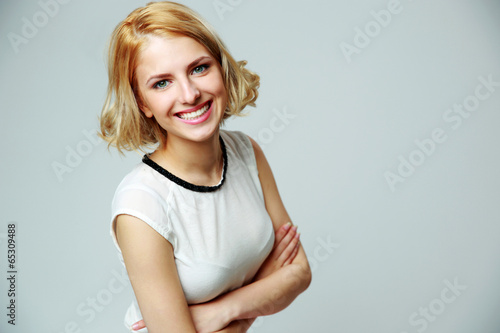 Portrait of a happy smiling woman with arms folded