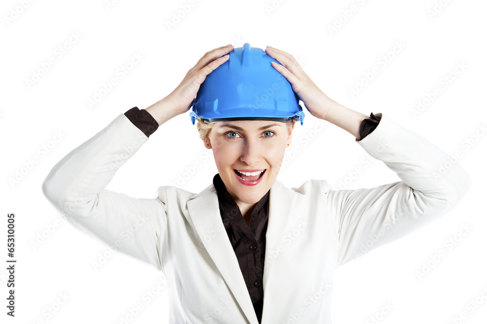 Portrait of confident young female architect standing arms over Portrait of confident young female architect standing arms over