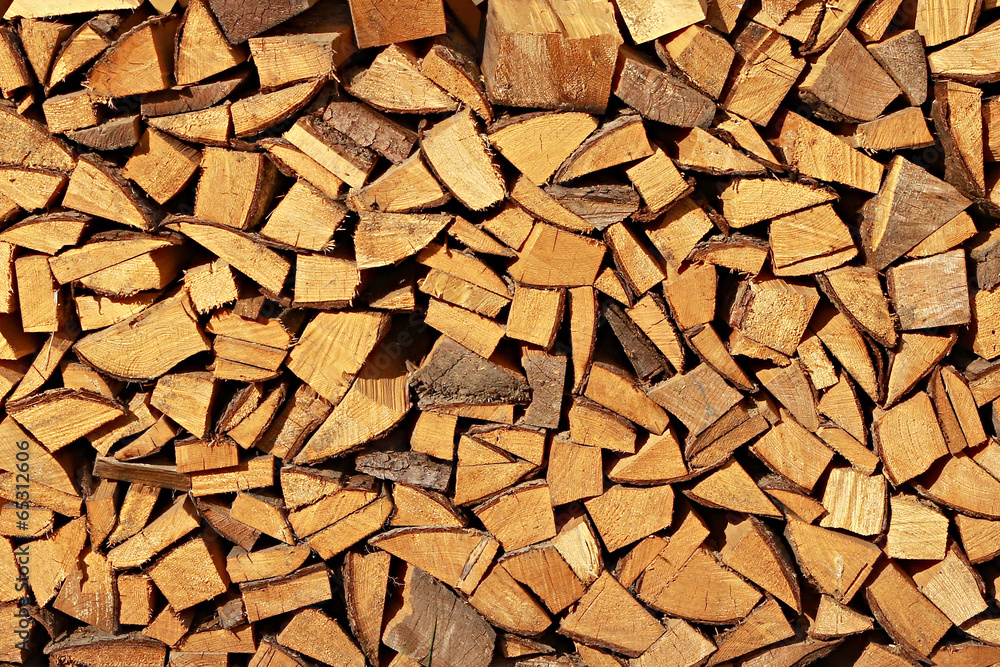 A stack of spruce firewood - a natural horizontal background.. A stack of spruce firewood - a natural horizontal background..